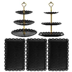 three tiered trays with black plates and gold handles, each holding an empty plate