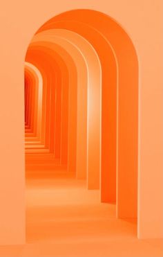 an orange tunnel with arches leading into the light