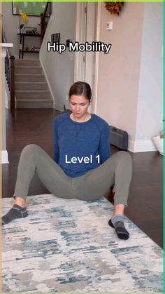 a woman sitting on top of a rug with the words level 1 above her head