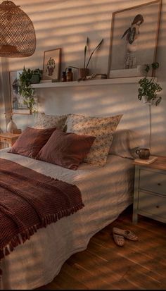 a bed sitting in a bedroom next to a window with blinds on the windowsill