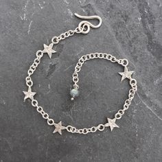 Little Star Bracelet  sterling silver by AWolfandI on Etsy Jewelry Charms Pendants, Star Chain, Owl Necklace, Star Bracelet, Silver Stars, Chain Link Bracelet, Silver Bracelets, Sterling Silver Bracelets, Silver Bracelet