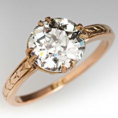 an antique diamond engagement ring in yellow gold