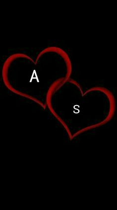 two red hearts with the letter s on them in front of a black background that says,