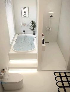 a bathroom with a bathtub and toilet in it