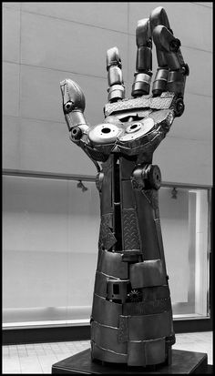 a black and white photo of a robot hand