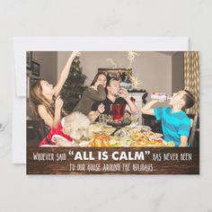 a group of people sitting around a table celebrating christmas