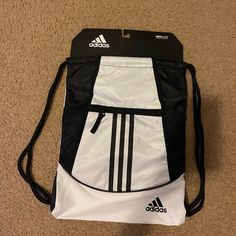 New /Not Used Black And White Medium Sized (Ask For Measurements If Wanted) Sporty Shoulder Bag For Everyday Use, Sporty Black Backpack For Gym, White Sporty School Bag, Sporty White School Bag, Sporty Gym Bag For Sports, White Adidas Sporty Backpack, White Backpack Gym Bag For Travel, Adidas Sporty White Backpack, Adidas White Sporty Backpack