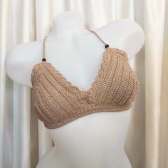 Handmade Crochet Bikini Top for Women Beachwear Dive into summer with our stunning handmade crochet bikini top, a perfect addition to your beachwear collection. Crafted with care and attention to detail, this bikini top combines comfort, style, and functionality for the ultimate beach experience. **Features Color: Elegant brown Size: Adjustable back and neck straps ensure a perfect fit for any body shape. Material: Made with high-quality, %100 cotton, durable yarn for long-lasting wear. Customizable: Tailored to your cup size for a personalized fit. **Why You'll Love It Handmade Quality: Each piece is meticulously handcrafted, ensuring unique and high-quality workmanship. Comfortable & Stylish: Soft yarn and a flattering design provide both comfort and chic style. Versatile: Perfect for th Crochet Beachwear For Beach Season, Crochet Halter Neck Swimwear For Beach, Crochet Triangle Top Swimwear For Beach, Seamless Halter Neck Crop Top For Beach, Fitted Crochet Top For Beach, Beige Triangle Top Halter For Beach, Beige Triangle Halter Top For Beach, Beachwear Crochet Triangle Top For Beach Party, Beachy Triangle Crochet Top For Vacation