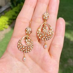 A pair of ultra lightweight, 22k gold chandbali earrings studded with pearls. The earrings weigh 7.26 gms including 0.25 gms in the hanging pearl drops Gold Chandbali Earrings, Gold Chandbali, Jadau Jwellery, 22k Gold Jewelry Necklaces, 22k Gold Earrings, 22k Gold Jewelry, Chandbali Earrings, Pearl Necklace Set, Gold Jewelry Necklace