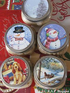 four tins with christmas images on them