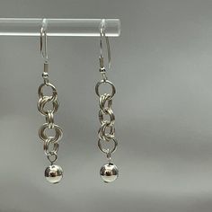 These earrings exude a sense of style! The chainmail gracefully drops down from your ear lobes, making them the perfect accessory. The Sterling Silver adds a touch of understated sophistication to your overall look, making it ideal for any occasion. We're excited to present your new earrings in our beautifully designed, eco-friendly branded box with a complimentary cleaning cloth. It's an excellent gift for any occasion, and we're happy to ship it directly to your loved ones. We offer free shipp Modern Earrings With Silver Chain For Gift, Silver Chain Metal Earrings As Gift, Silver Chain Drop Earrings Gift, Elegant Dangle Earrings With Silver Chain, Elegant Silver Chain Dangle Earrings, Dangle Earrings With Silver Chain, Silver Chain Dangle Earrings Gift, Silver Chain Dangle Earrings, Silver Long Drop Earrings With Chain