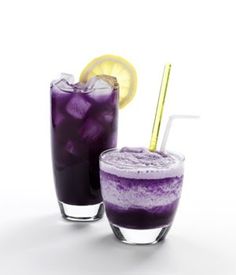 two glasses filled with purple liquid next to each other