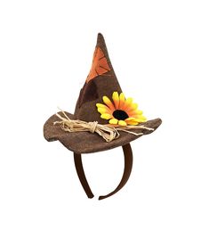 a brown hat with a sunflower on it