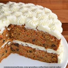 a carrot cake with white frosting on a plate