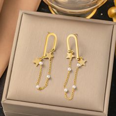 Elevate your accessory game with the LOVCIA Titanium Steel Star and Pearl Multi-Layer Chain Dangle Earrings for Women. These exquisitely crafted earrings effortlessly blend elegance and modern design, making them the perfect addition to any outfit. Key Features: Premium Material: Made from high-quality titanium steel, ensuring durability and a beautiful finish. Electroplating Treatment: Offers a lustrous and long-lasting shine, maintaining their new look over time. Geometric Shapes and Designs: Black Friday Jewelry, Steel Light, Mens Stainless Steel Rings, Jewelry Organizer Storage, Luxury Earrings, Layered Chains, Natural Stone Bracelets, Mens Beaded Bracelets, Gold Plated Bracelets