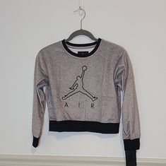 Jordan Sweatshirt -Gray/Black -Jumpman Logo On Front -Soft Velour Type Feel -Crew Neck -Material Listed In Photos Xxl:19.5" U To U| 20" L All Measurements Are Approximate. Gray Long Sleeve Top With Logo Print, Sporty Gray Sweater With Graphic Print, Heather Grey Long Sleeve Tops With Logo Print, Heather Grey Long Sleeve Top With Logo Print, Jordan Sweatshirt, Jordan Logo, U 20, Jordan Shirts, Jumpman Logo