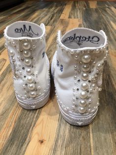 Having a party? What a great idea. Sweet 16, Bat Mitzvah or any special occasion! Let's add some PEARLS & BLING to your day. How pretty are these? I can do the monochrome all white shoe like picture or many other colors, some colors are special order available You can do them: With or without the date. With or without the monogram. ie First name and middle name or a monogram on each shoe Each shoe is custom decorated so they may vary a bit with the Pearls and the Bling but they all will be B Pearl Sweet 16, Sweet 16 Shoes, Monogram Converse, Bling Wedding Shoes, All White Shoes, Pearl Wedding Shoes, Embroidered Sneakers, Bridal Sneakers, All White Sneakers