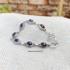 Welcome to our shop : -  Moonlightjewellerygift Garnet Bracelet, 925 Sterling silver Bracelet, Gemstone Bracelet, Dainty wristband, Oval Shape Bracelet, Beautiful Bracelet, Dainty Bracelet, Meditation Bracelet, Jewellery Bracelet, Gift For Her,  title-Garnet Bracelet 925 Sterling Silver Bracelet, Birthstone Jewelry, Charm Bracelet, Handmade Bracelet, Gift For Her, Anniversary Gift Jewelry, Garnet Garnets can come in virtually any color, but the most well-known are red. Before the development of modern gemology, many people treated all transparent red gemstones as the same type of stone. Therefore, you'll find many similarities between the folklore of garnets and rubies. Garnets with gorgeous, deep shades of red are said to energize wearers, which could help them deal with health issues. We Bohemian Sterling Silver Crystal Bracelet Gift, Sterling Silver Gemstone Bracelet Gift, Silver Gemstone Bracelets For Gifts, Silver Gemstone Chain Bracelet Gift, Sterling Silver Gemstone Chain Bracelet As Gift, Silver Dainty Gemstone Bracelets, Silver Dainty Gemstone Bracelet, Silver Spiritual Bracelets With Gemstones, Adjustable Silver Oval Chain Bracelet