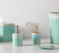 bathroom accessories including soap dispenser, toothbrush holder and tissue dispenser