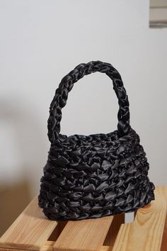 "This beautiful handbag is a perfect blend of craftsmanship and elegance. Carefully crocheted by me, this unique accessory is designed to elevate your style and make a statement wherever you go. This handbag holds a phone of any size, is comfortable to hold in your hand and it compliments every outfit. It s perfect as a Mother's Day gift, Valentines gift or a \"just because\"-gift.  Key features: 🤍 Material: Immerse yourself in luxury with the finest satin ribbon meticulously crocheted to perfection. The silky-smooth texture not only adds a touch of opulence but also ensures durability, making this bag a timeless addition to your collection. 🤍 Dimensions: With a compact size of 22 x 15 x 3 cm, this bag strikes the ideal balance between functionality and style. It's spacious enough to acc Crochet Handbag, Satin Bags, Top Handle Bags, Beautiful Handbags, Just Because Gifts, Handbag Black, Crochet Handbags, Valentines Gift, Handmade Accessories