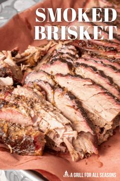 sliced brisket sitting on top of a red paper wrapper with the words smoked brisket written above it