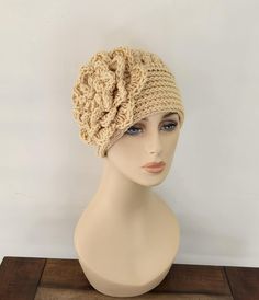 Crochet women's hat with large flower.  Flower is about 7". It's simple yet chic and comfortable.  I make the hats fits to average adult head 22" but if you need different size please leave a note at the check out what size you want.  The color in the picture is dark cream.  If you want flower 2 different colors you can leave a note at the check out what colors. Always smoke, pet free environment. Adjustable Cream Beanie, Adjustable Knitted Cloche Hat, Spring Flower Crochet Hat One Size, Cream Crochet Hat For Spring, One Size, Cream Crochet Hat One Size For Spring, Spring Cream Crochet Beanie, Cream One Size Crochet Hat For Spring, Beige Crochet Beanie Hat For Spring, Beige Crochet Beanie For Spring