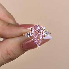 Elegant Rose Gold Pear Cut Pink Sapphire Three Stone Engagement Ring In Sterling Silver Three Stone Engagement Ring, Jewelry Tags, Stone Engagement Ring, Three Stone Engagement, Three Stone Engagement Rings, Gift Package, Stone Engagement, Ring Size Guide, Promotional Gifts