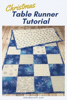 the christmas table runner is made with blue and white squares