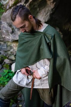 https://sagittariuscraft.etsy.com

Embrace the medieval and Viking eras with our half-circle woolen cloak, designed to fall around ankle to mid-calf level. This practical and versatile hoodless cape is perfect for traveling, LARP, reenactment, cosplay, weddings, and more. It adds a striking finishing touch to a variety of costumes, including ranger, bandit, Viking axeman, and adventurer.

#viking #medieval #warrior #axeman #fantasy #cloak #shield #historical #adventurer Medieval Style Winter Cape For Larp, Medieval Winter Cape For Larp, Viking Medieval Dress For Larp In Winter, Elven Outerwear For Medieval Festivals, Elven Style Medieval Dress For Larp In Fall, Elven Medieval Dress For Larp In Fall, Medieval Cape For Larp In Fall, Medieval Style Cape For Larp In Fall, Medieval Cape For Fall Larp Events