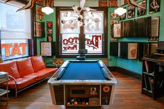 a pool table sitting in the middle of a room