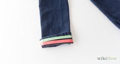 a pair of jeans with colorful stripes on them