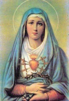 the immaculate mary with her hands on her chest, wearing a blue shawl and holding a