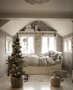 a bedroom with a christmas tree in the corner