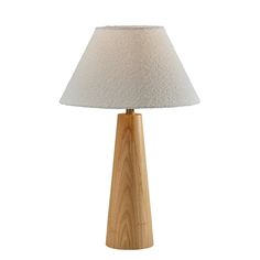 a wooden table lamp with a white shade