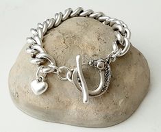 silver bracelet for woman equestrian style horse lovers bracelet with a beautiful horse toggle design very unique pewter, brass and silver plated high quality the chain dimensions is approximately 10mm x 13mm is heavy but very comfortable to wear it. Adjustable Silver Charm Bracelet With Chunky Chain, Silver Horse Design Bracelet Jewelry, Silver Horse Design Bracelet Gift, Silver Bracelet With Horse Design For Gift, Silver Horse Design Jewelry Bracelet, Women's Equestrian, Lovers Bracelet, My Horse, Silver Bracelets For Women