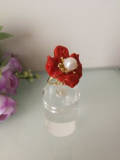 Elegant ring with natural red Mediterranean coral in the shape of a flower, central white baroque natural pearl, handcrafted gold gilded brass setting. Coral flower size: 3 cm. Adjustable ring size. Elegant Red Flower Ring, Elegant Handmade Red Flower Ring, Coral Flower, Coral Flowers, Coral Ring, Handmade Frames, Natural Pearl, Gold Gilding, Elegant Ring