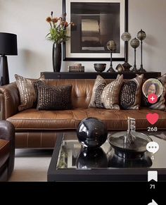 a living room filled with lots of brown furniture