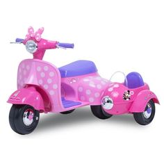 a pink scooter with polka dots on it