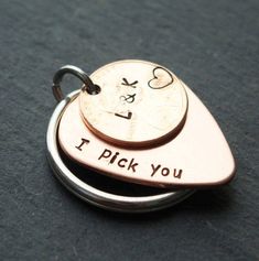 two metal tags with the words i pick you on them