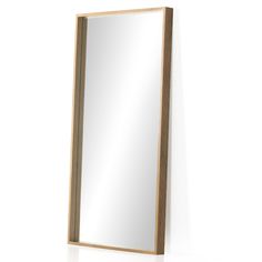 a wooden mirror hanging on the wall