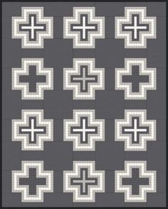 a black and white quilt with many different crosses on the front, one in grey