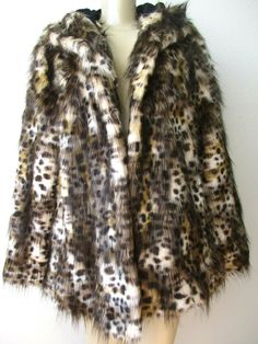 ADRIENNE LANDAU LEOPARD DESIGN FAUX FUR HOODED COAT BRAND - ADRIENNE LANDAU SIZE - S BUST - 36" HIPS - 38" SLEEVE - 24" LENGTH - 27" MATERIAL - SHELL - 100% POLYESTER   LINING - 100% POLYESTER FILING - 100% POLYESTER COLOR - MULTI-COLOR - LEOPARD DESIGN FULLY LINED CONDITION - NWT FRONT EYE & HOOKS CLOSURE 2 FRONT POCKETS SOFT & BEAUTIFUL DRY CLEAN ONLY MADE IN CHINA     Check out my other item Fall Leopard Print Fur Coat With Faux Fur Lining, Fall Leopard Print Faux Fur Coat, Fitted Faux Fur Outerwear In Leopard Print, Fitted Leopard Print Faux Fur Outerwear, Winter Leopard Print Faux Fur Outerwear, Leopard Print Outerwear With Faux Fur Trim, Winter Leopard Print Outerwear With Faux Fur Trim, Leopard Print Faux Fur Coat With Lining, Hooded Leopard Print Winter Outerwear