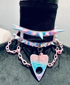 NEW Spike Pastelgoth Ouija Choker Handmade and Unique Pink and blue spikes Pink plastic chain and Ouija charm detail Pink satin tie closure Perfect for #goth #punk #pastelgoth #kawaii #cosplay Spiked Collar, Creepy Cute Fashion, Pastel Punk, Pastel Goth Outfits, Badass Outfit, Star Guardian, Goth Accessories, Pastel Goth Fashion, Kawaii Cosplay