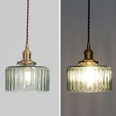 two glass pendant lights hanging from the ceiling, one with a cord attached to it