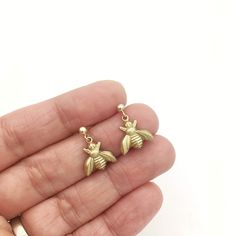 These honeybee earrings are handcrafted in the USA! These brass bumblebee earrings make the perfect gift for the bug lover in your life. Insect jewelry also makes a great gift for science teachers, gardeners, entomologists or entomology students -- any insect lover that can appreciate the tiny magic of our six-legged cousins! 💕🐜🐞🐝🦗🐛🦋💕 The ear wires on these bee charm earrings come with hypo-allergenic plastic clutches so they don't slip out! The ear wires are gold-filled, so they are gre Insect Jewelry Design, Bee Jewellery, Bug Earrings, Insect Ring, Insect Necklace, Honey Bee Earrings, Bee Pin, The Bug, Bee Jewelry