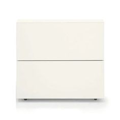 a white dresser with two drawers on it's sides, and one drawer is closed