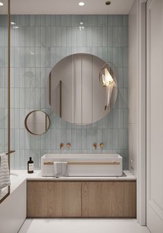 a bathroom with a sink, mirror and towel rack