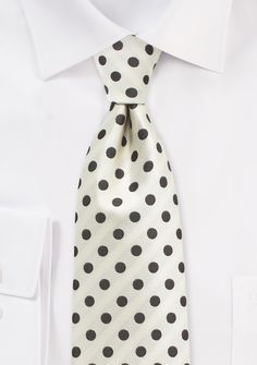 The Ivory and Brown Polka Dot Necktie is a versatile accessory that complements a variety of suits for men's weddings, shopping for suits, or tuxedos. Its neutral color scheme allows it to pair well with both dark and light-colored suits, including black, navy, gray, and tan. The polka dot design adds a touch of personality and style to any outfit, making it perfect for both formal and semi-formal occasions. Whether you're attending a wedding, a business meeting, or a special event, this necktie White Ties For Black Tie Events, White Dapper Ties For Black Tie Events, Dapper White Ties For Black Tie Events, Dapper White Tie For Black Tie Events, White Standard Tie For Formal Occasions, Dapper White Suit And Standard Tie Accessories, Elegant White Tie For Groom, Business Polka Dot Ties, Elegant Polka Dot Ties