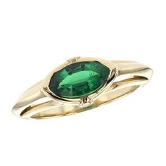 14K Yellow Gold Lab-Grown Emerald, and Natural Diamond East-West Ring. Containing One Marquise-Cut Lab-Grown Emerald Colored Stone, Weighing 1.10 Cts. Also Containing Two Round Diamonds, Weighing 0.02 Cttw. The Diamonds Are G-H Color, And SI Clarity. Visit our Dallas Showroom to shop this piece and many more from our Gemstone Collection. Green Marquise Emerald Rings, Formal Green Birthstone Ring With Accent Stones, Heirloom Oval Green Emerald Ring, Classic Green Gemstone With Center Stone, Heirloom Green Ring For May Birthstone, Heirloom Green Emerald Jewelry, Oval Green Gemstones In 14k Gold, Oval Green Gemstone Birthstone Ring, Heirloom Style Green Emerald Ring With Center Stone