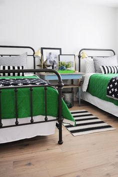 a bed room with two beds next to each other